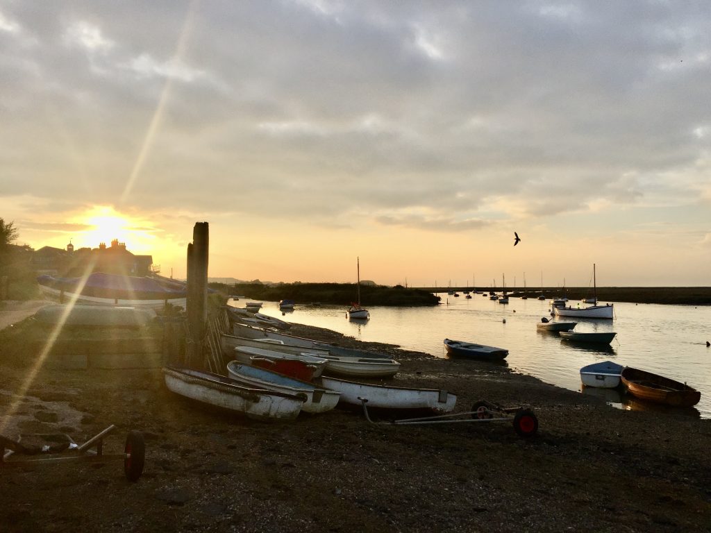 A boat parked next to a body of water
Description automatically generated